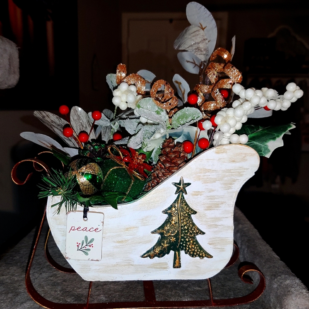 Hand painted sled and flower arrangement